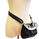 Meher KakaliaWomen’s black leather evening bag with white embroidered flap.