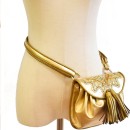 Meher KakaliaMetallic gold mini belt bag with embroidered flap and leather tassels.