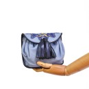 Meher KakaliaWomen’s embroidered leather waist bag in soft blue.