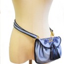 Meher KakaliaBlue leather mini belt bag with embroidered flap and tassels.