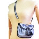 Meher KakaliaYacht blue leather crossbody bag with navy and gold hand embroidery.