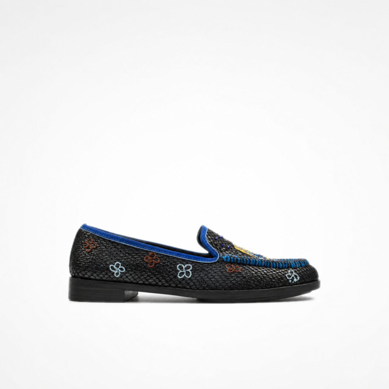 Black textured leather Rati Loafer with blue piping, small floral embroidery and a multicolour embroidered vamp