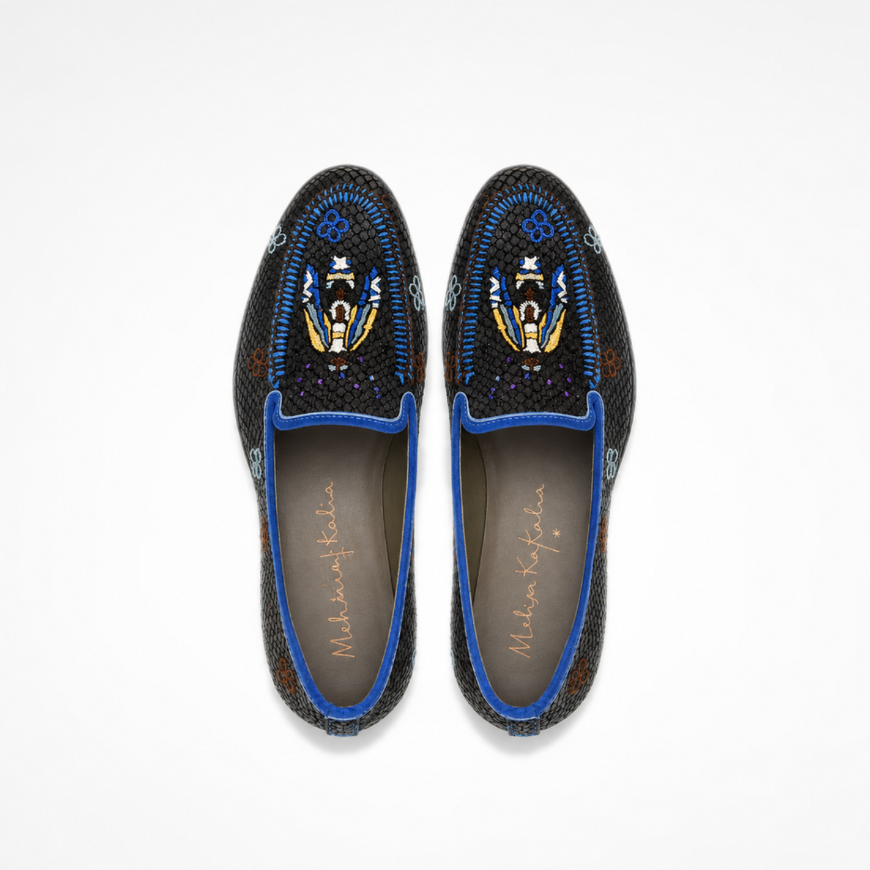 Pair of black Rati Loafers showing blue trim, embroidered floral details and multicolour figurative motifs on the vamps