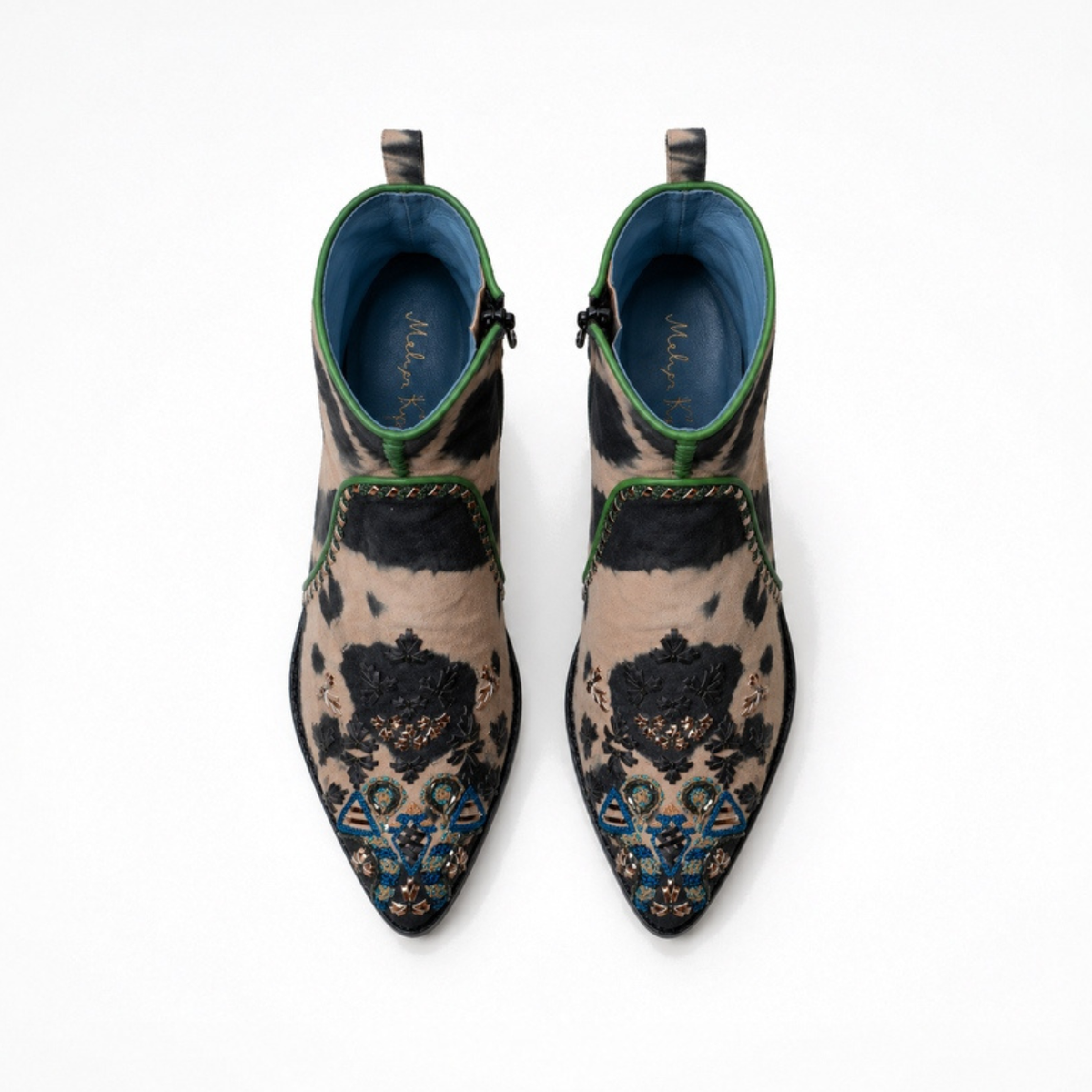 Top view of a pair of black-and-beige tie-dye suede MANI Point Heeled Boots with embroidered pointed toes