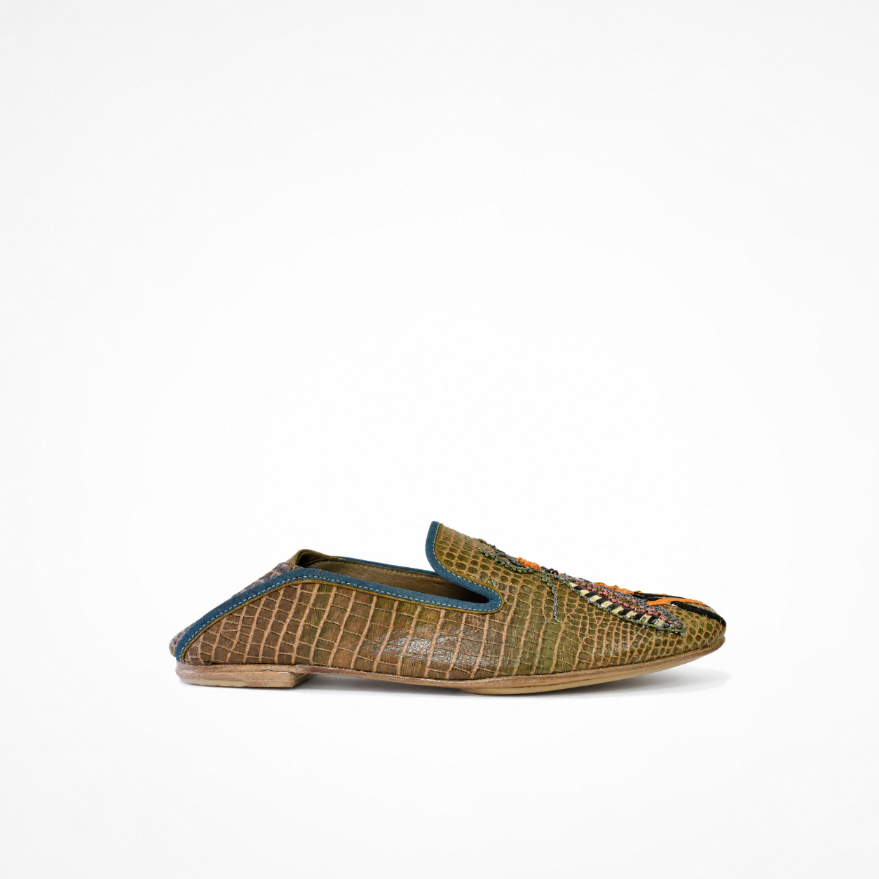 side view of an olive-brown croc-effect leather Luna Loafer with a rounded toe, low heel and blue trim