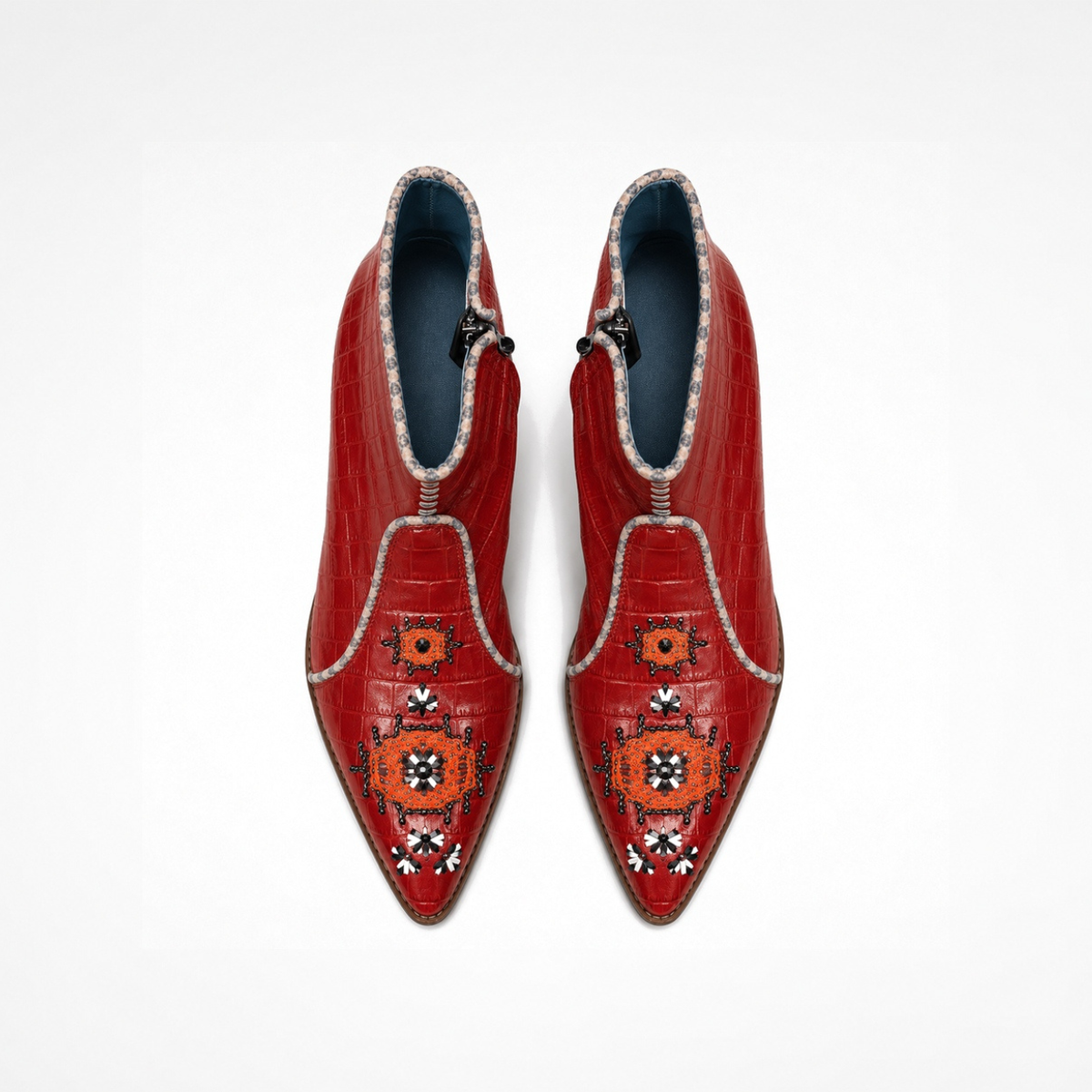 Pair of red croc-effect leather NANA heeled ankle boots with embroidered front panels, top view