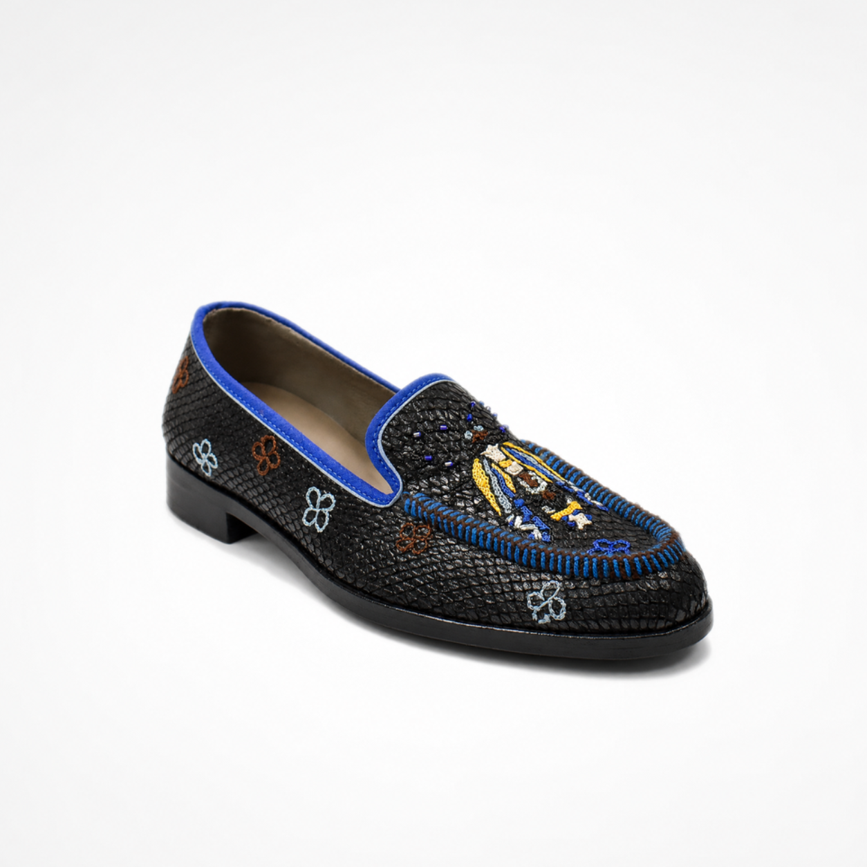 Black textured leather Rati Loafer with a multicolour embroidered vamp, blue whipstitching and low black heel