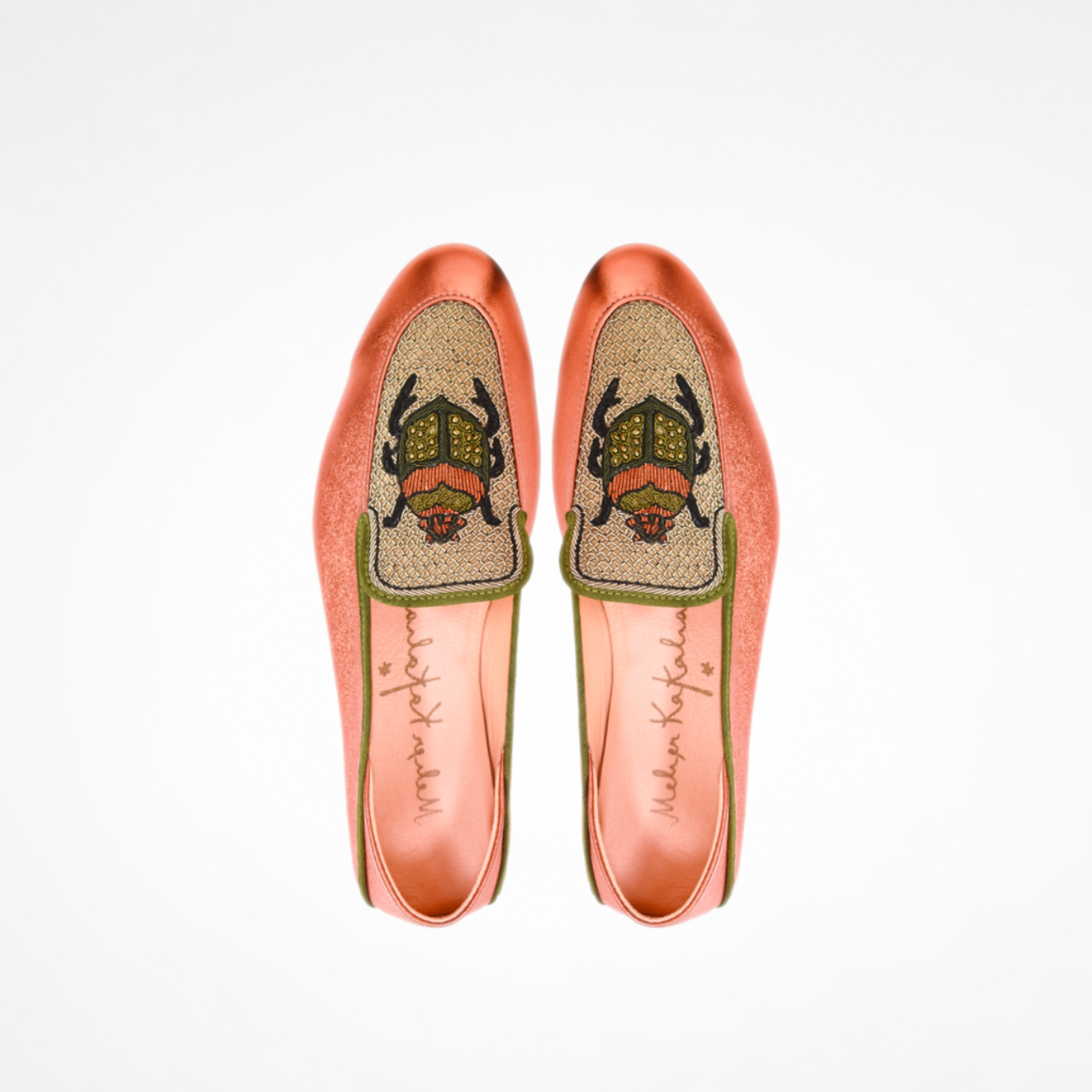 Pair of metallic orange Scarab Loafers showing gold-toned embroidered panels and olive-and-orange scarab motifs