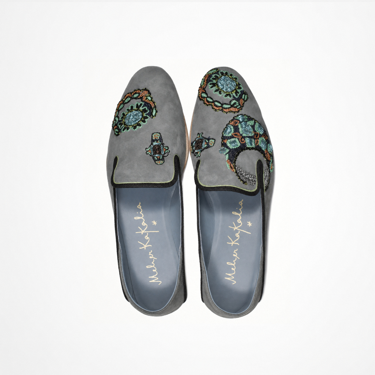 Top view of a pair of grey suede VITI Loafers with asymmetrical hand embroidery