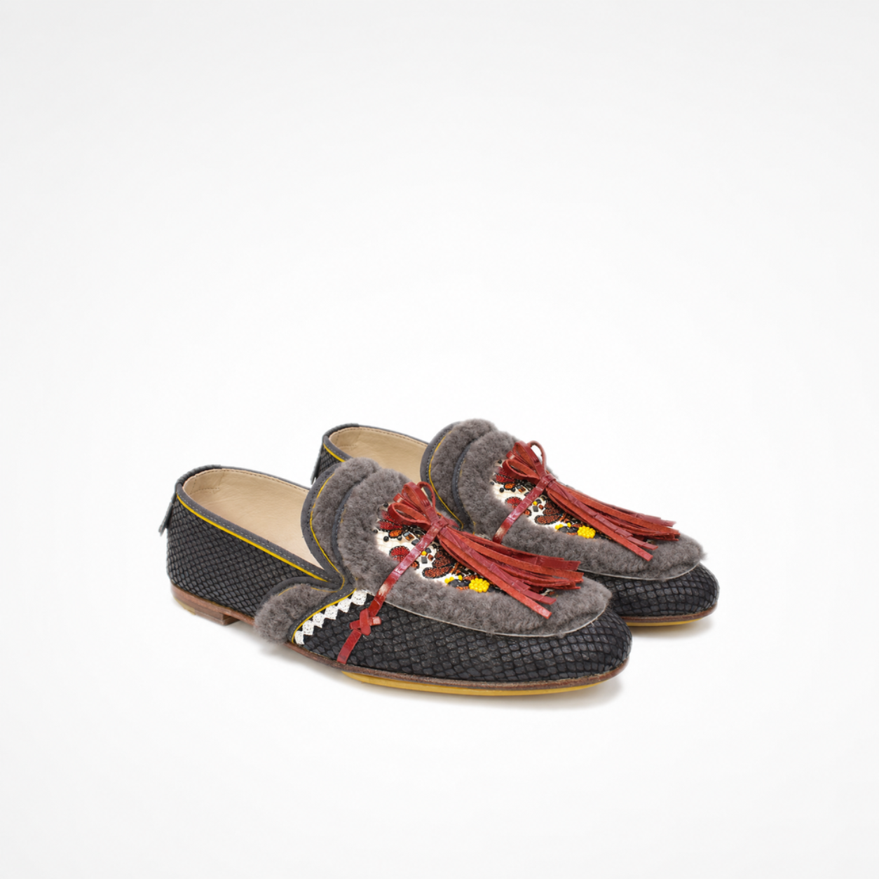 Pair of black snake-effect leather Oud loafers with embroidered vamps, grey faux shearling and red tassels
