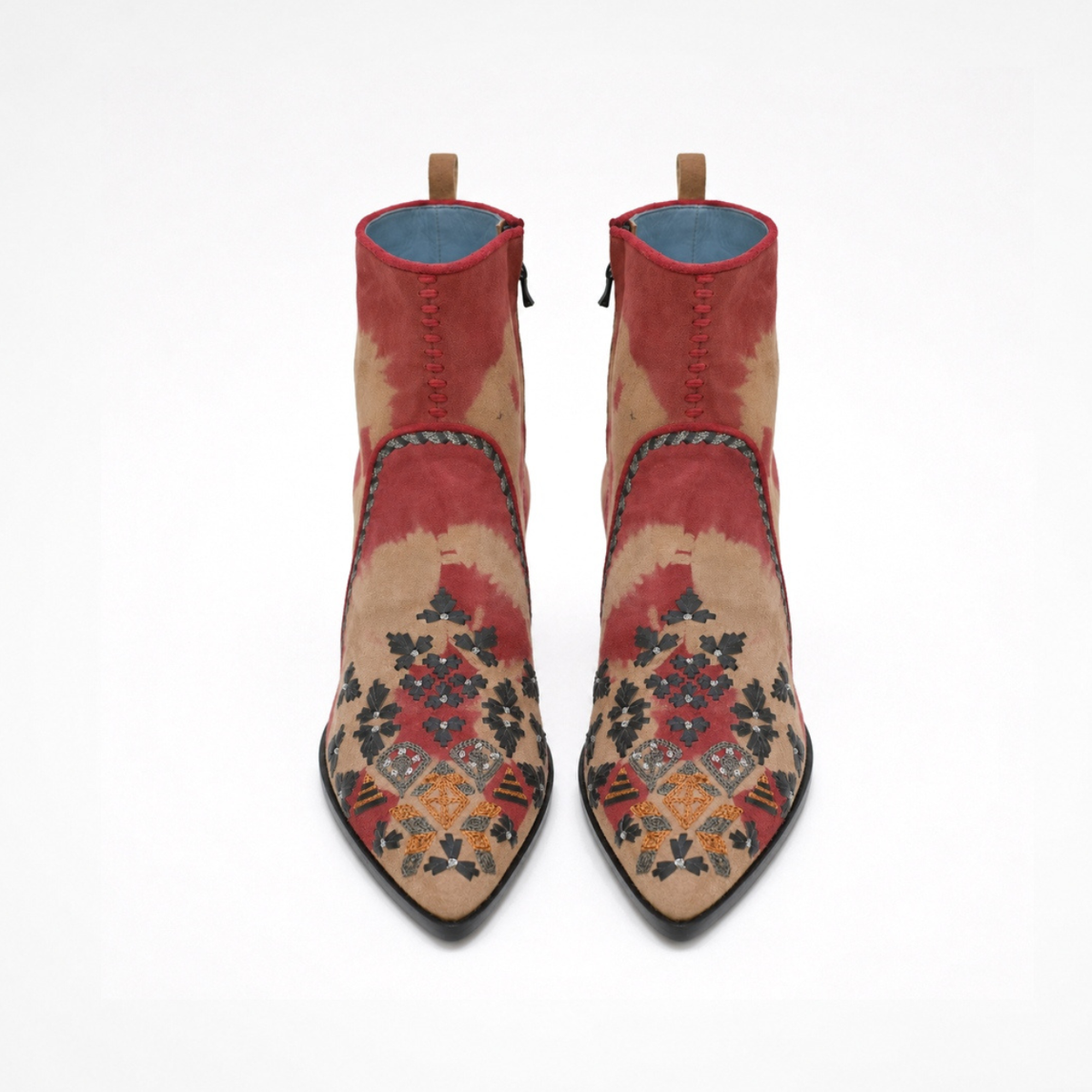 Front view of a pair of red-and-beige tie-dye suede MANI Point Heeled Boots with hand embroidery