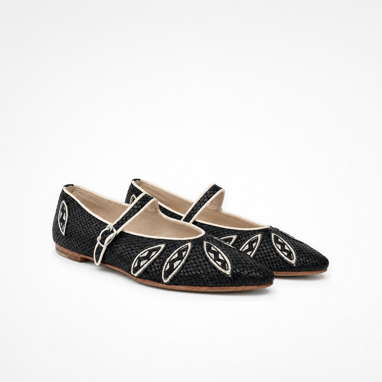 Pair of black textured leather Lullu Point Mary Jane ballet flats with pointed toes, white piping and embroidered leaf motifs