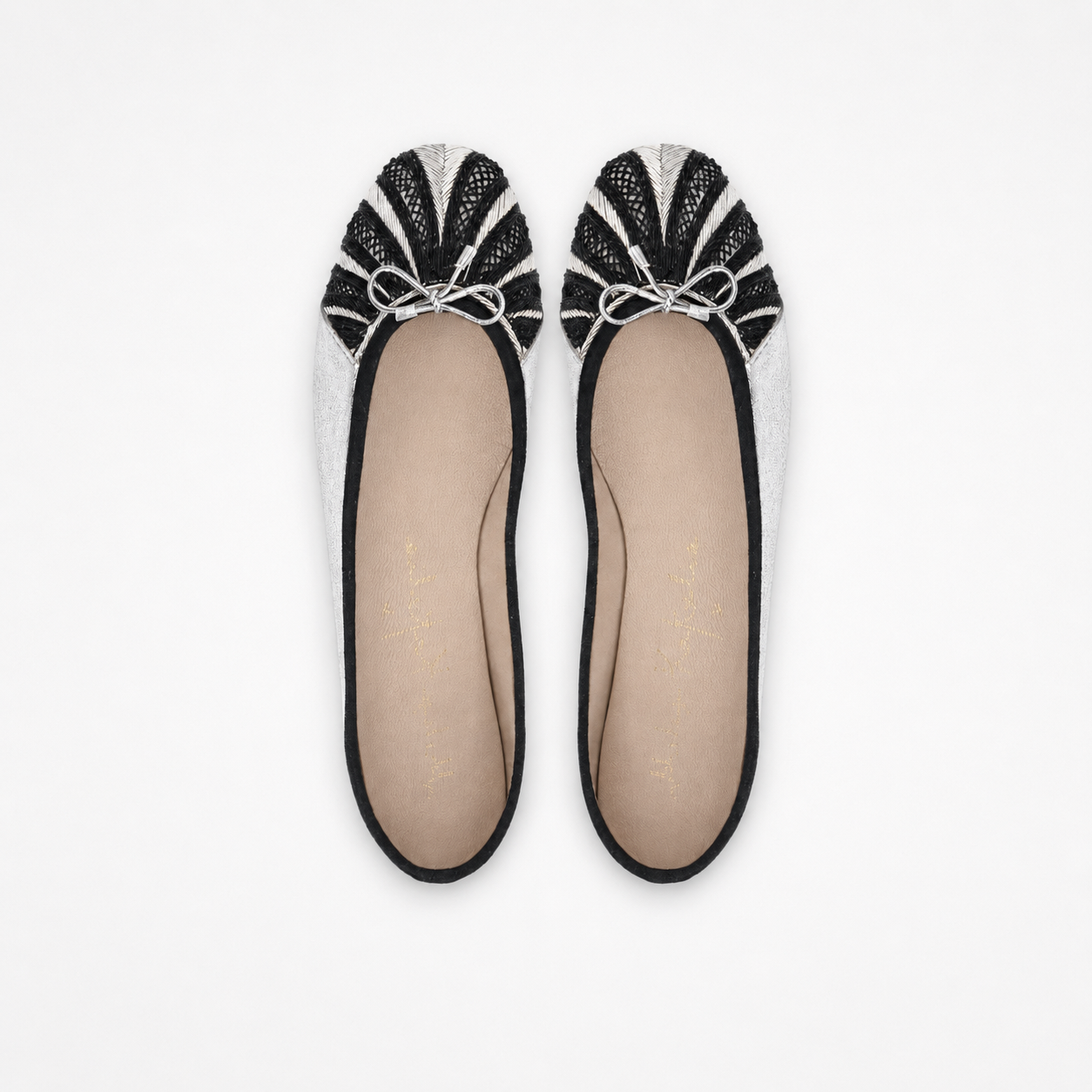 Pair of metallic silver Miami ballet flats with radiating black-and-silver embroidery and small bows