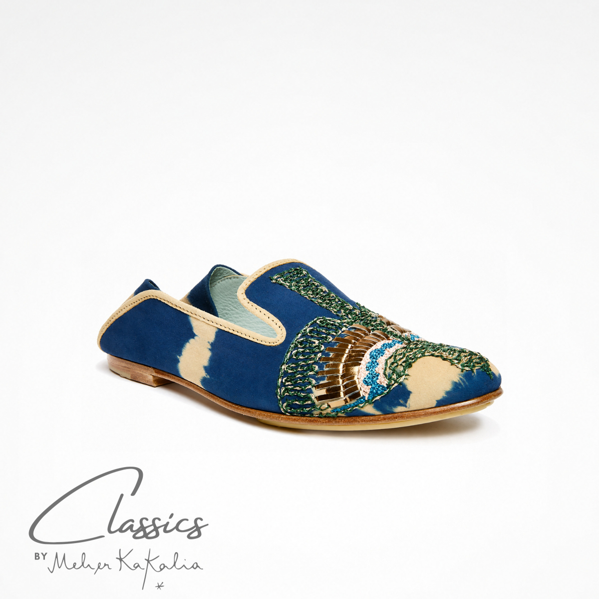 Pair of blue and beige tie-dye suede ANZU loafers with hand embroidery, angled view