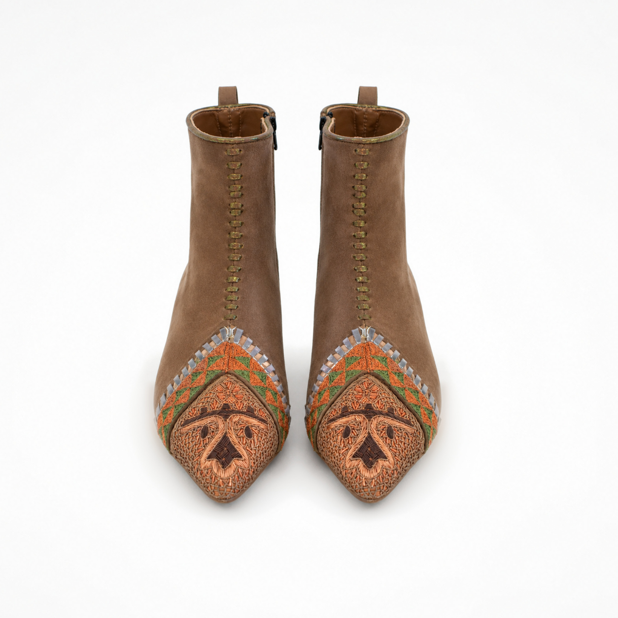 Pair of pointed toffee suede boots showing orange and olive embroidery and decorative front stitching