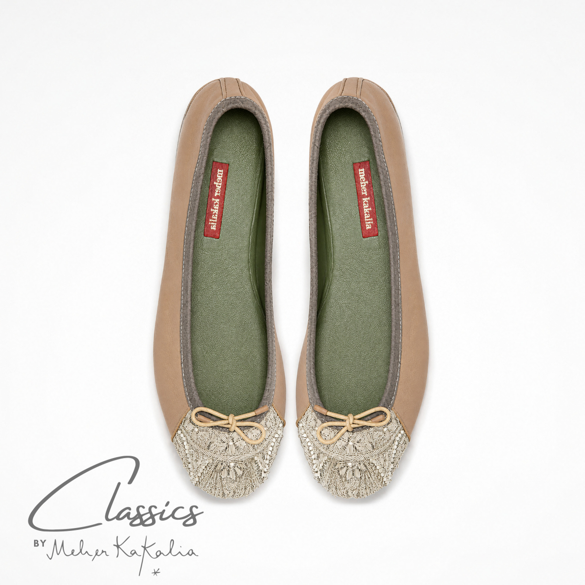 Pair of nude leather BIZI ballet flats with hand-embroidered toe caps, top view