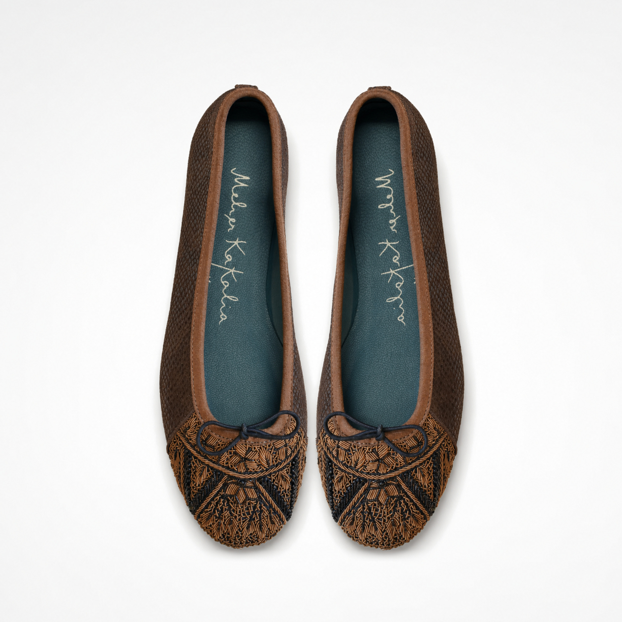 Pair of Bizi Ballet Prima flats in textured brown leather showing embroidered toe caps and bow details
