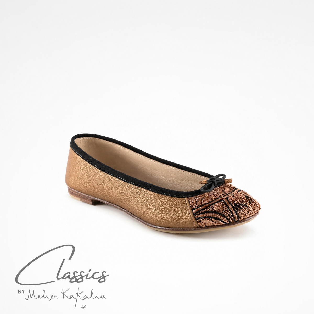 Gold leather BIZI ballet flat with hand-embroidered toe cap, angled view