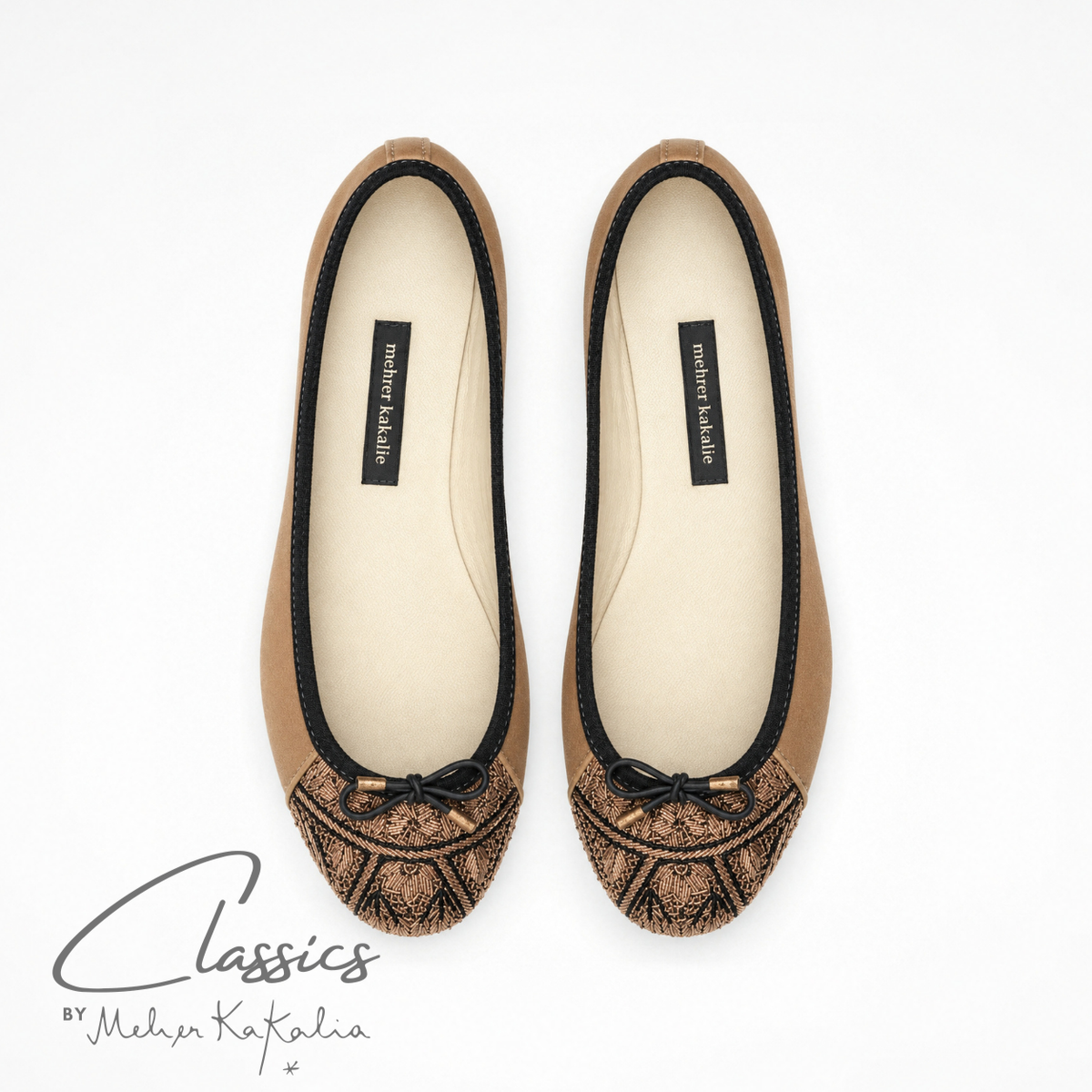 Pair of gold leather BIZI ballet flats with hand-embroidered toe caps, top view