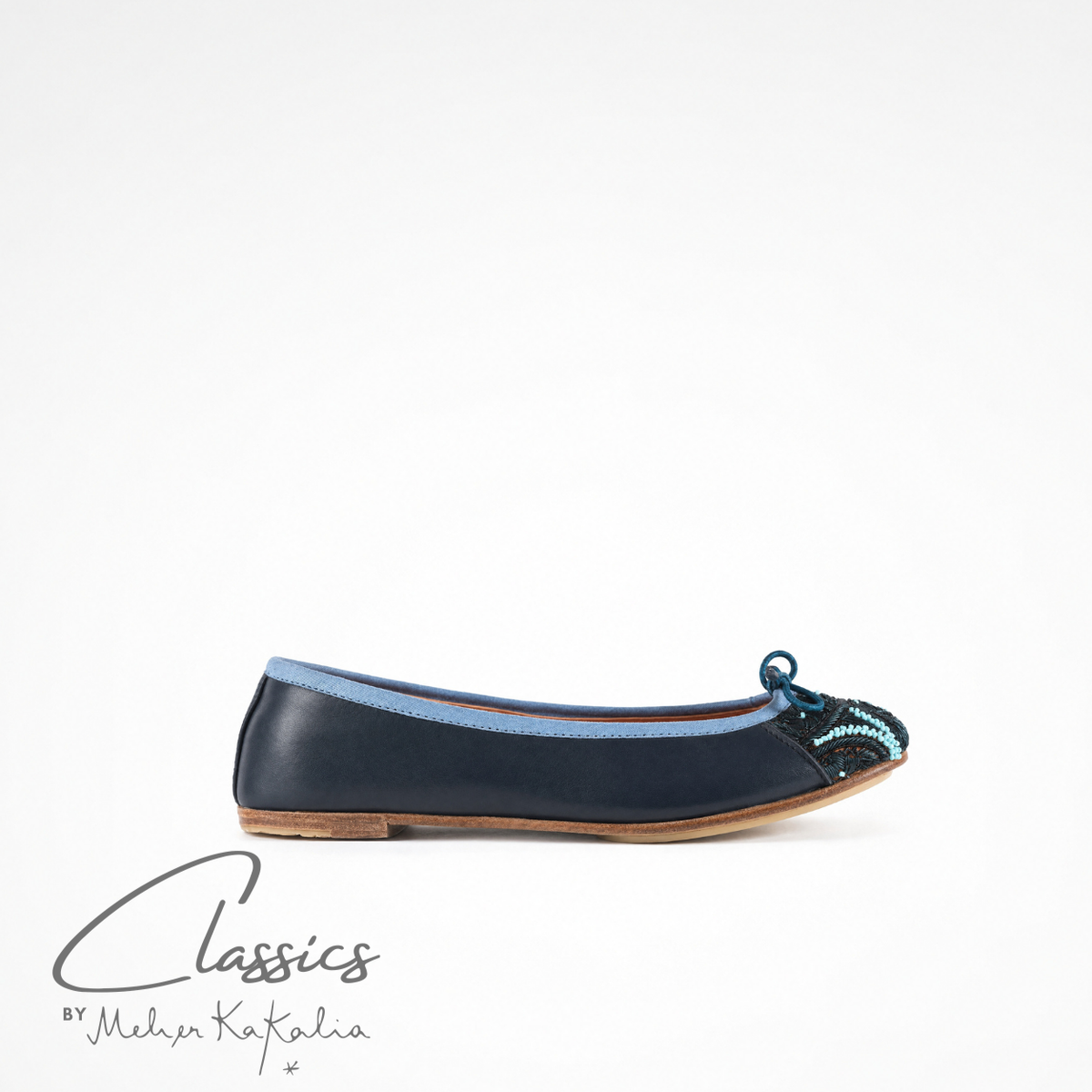 Navy leather BIZI ballet flat with hand-embroidered toe cap, side view