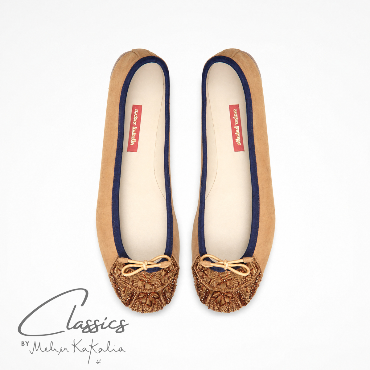 Pair of brown suede BIZI ballet flats with hand-embroidered toe caps, top view