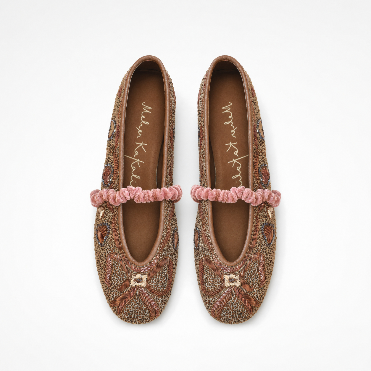 Pair of Darcey Ballet flats in copper showing embroidered bows, hearts and ruched straps