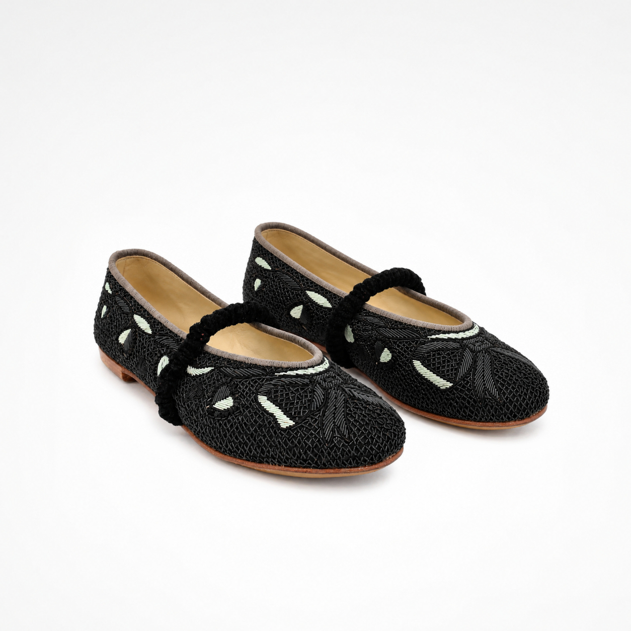 Pair of Darcey Ballet flats in black and teal with all-over embroidery and black ruched straps