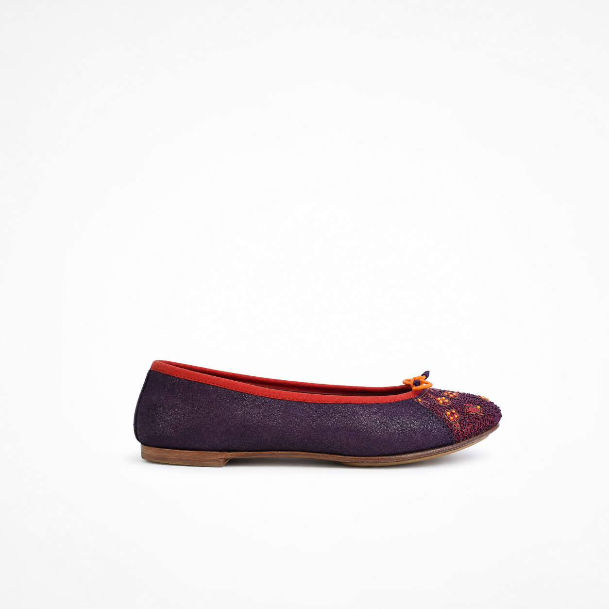Eden Ballet flat in beige leather, side view with black embroidered toe panel 