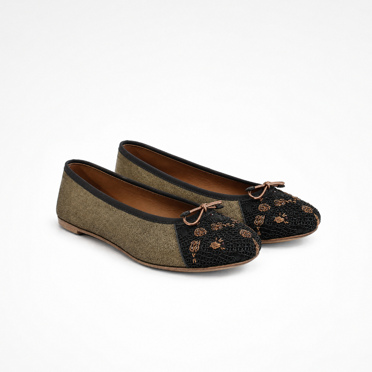Pair of Eden Ballet flats in beige and black leather with embroidered toe panels and bow detail 