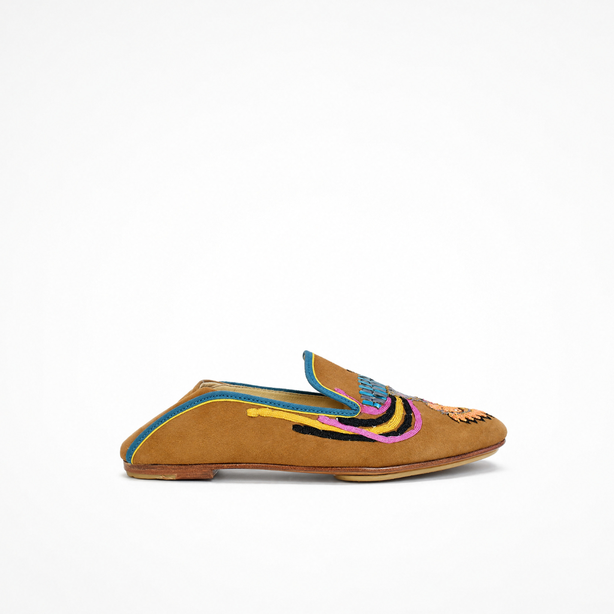 Halaka Moccasin in spice suede showing layered embroidery across the vamp and side