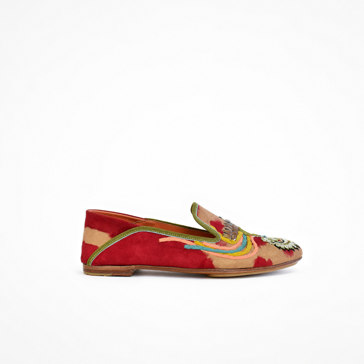 Red and beige tie-dye moccasin with low-profile sole, embroidered bird detail and green trim