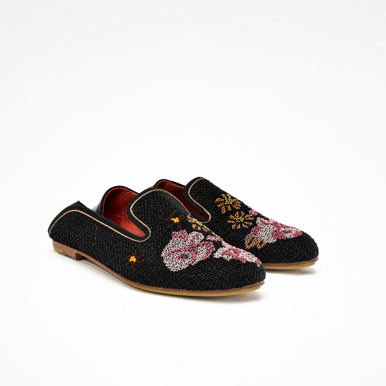 Pair of black Queen Nora embroidered loafers with pink floral motifs, red leather lining and smooth black leather heel panels

