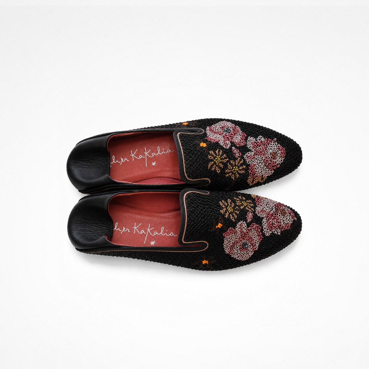 Pair of black Queen Nora Loafers showing floral fine-coil embroidery, rounded toes and red Nappa leather lining