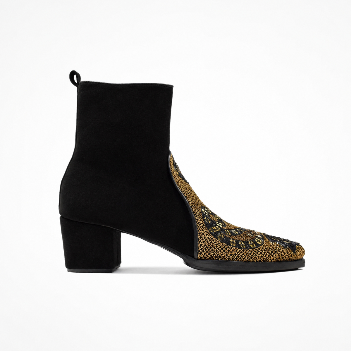 Side view of the black suede QUEEN PHYLLIS pointed heeled boot with a gold embroidered front panel and block heel