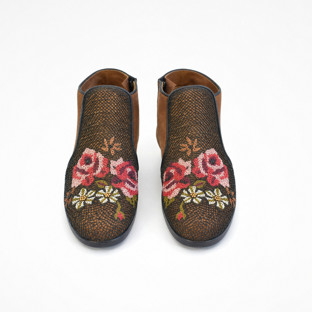 Pair of Queen Nora ankle boots, front view showing black fine-coil embroidered panels with red, pink, olive and white floral motifs