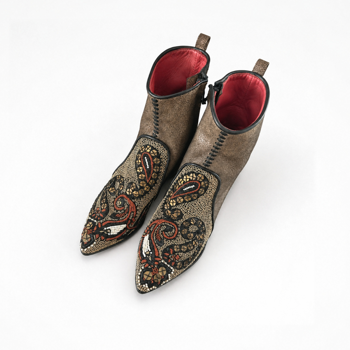 Pair of Queen Phyllis Point Heel ankle boots showing embroidered pointed toes and bronze-brown leather uppers