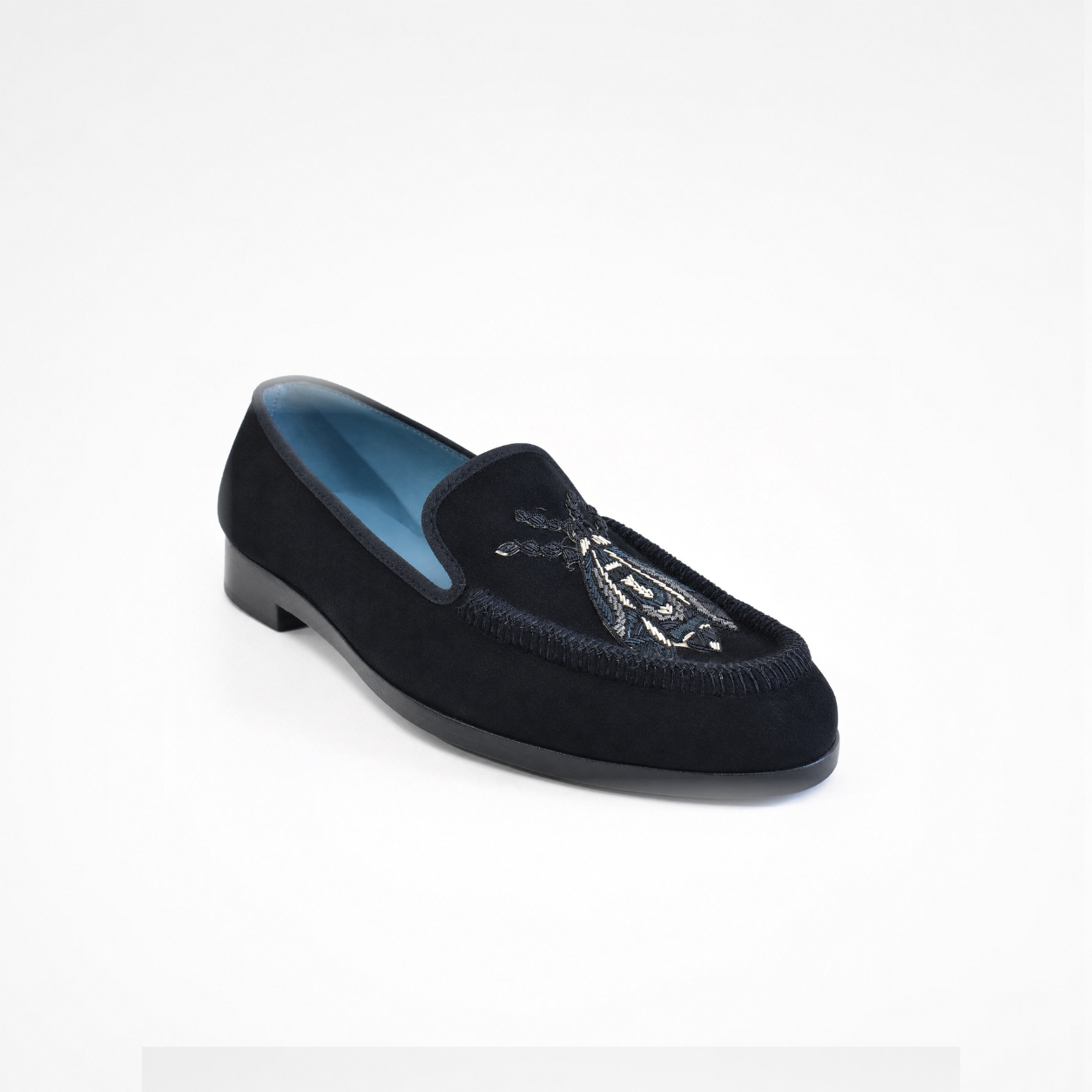 Black suede loafer with embroidered insect motif, rounded toe and blue lining