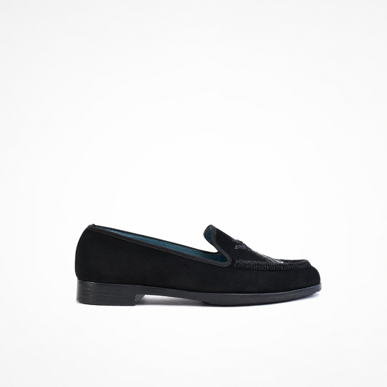 Black suede slip-on loafer with low heel and embroidered vamp