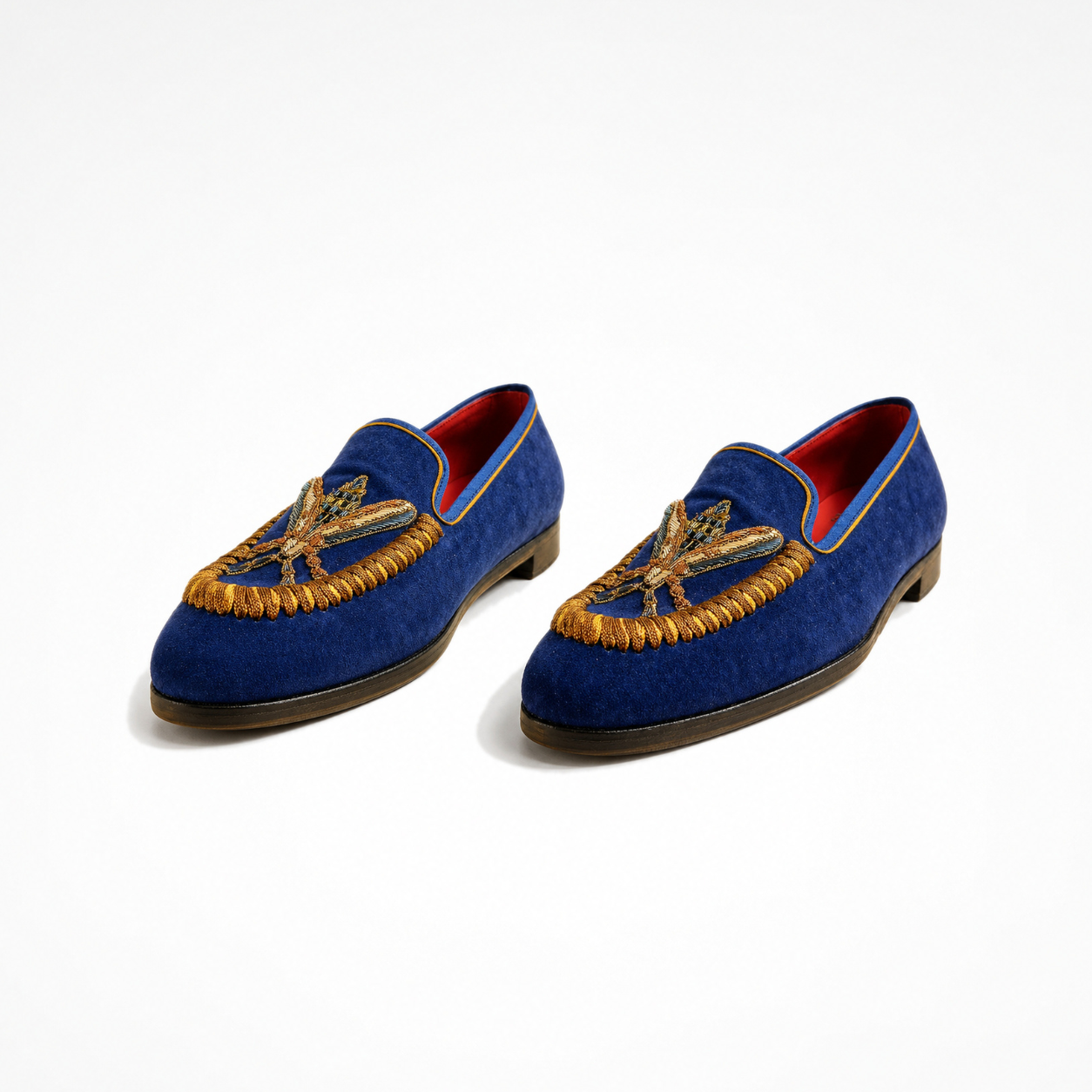 Pair of Rati Loafers in navy suede with gold and orange embroidered insect motifs