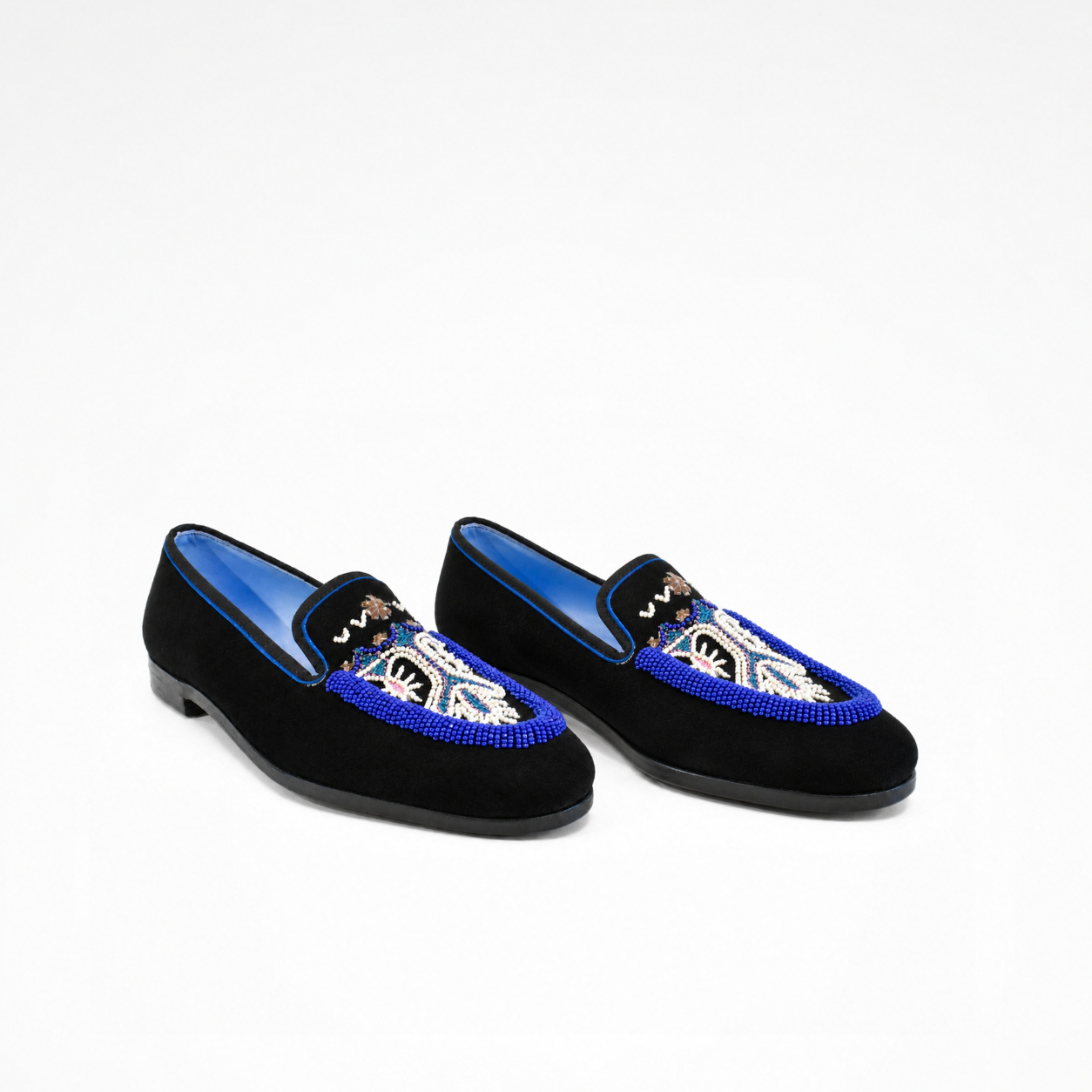 Pair of Sahara Loafers in black suede with blue and white beaded embroidered vamps