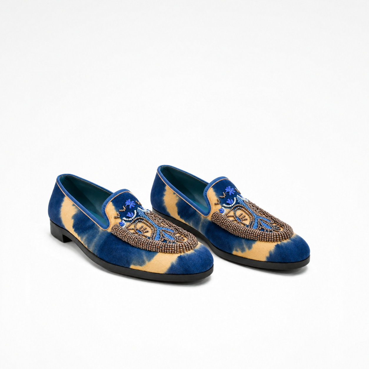 Pair of Sahara Loafers in blue and beige tie-dye suede with beaded embroidered vamps