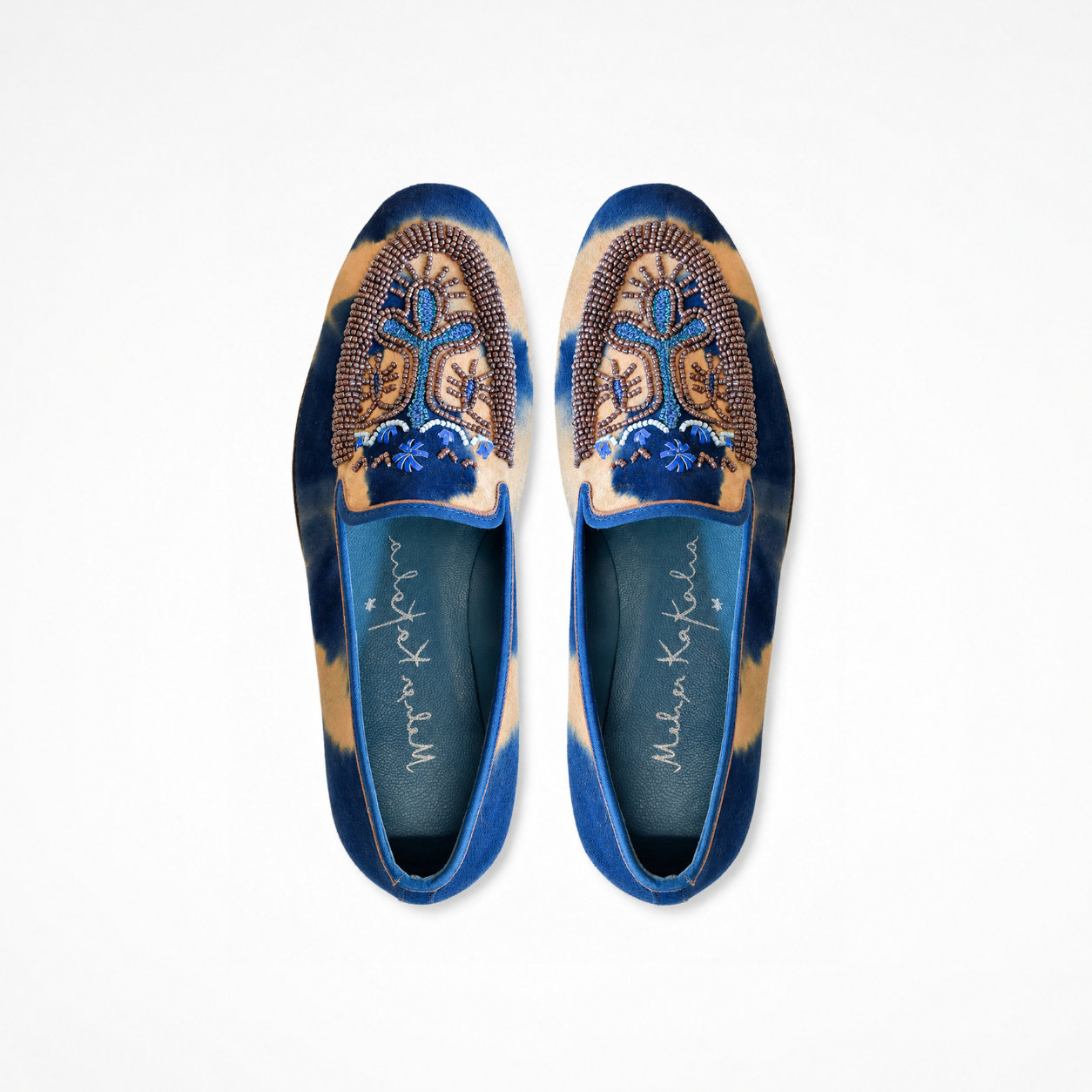 Pair of Sahara Loafers in blue and beige tie-dye suede with beaded embroidered vamps