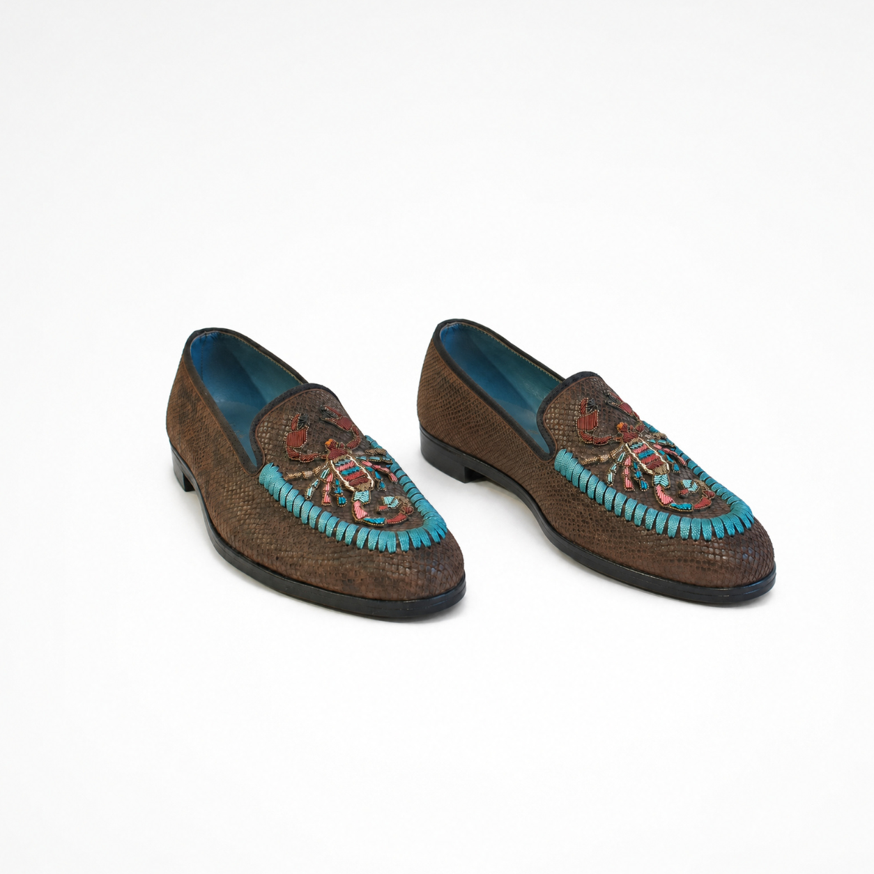 Pair of Scorpio Loafers in textured brown leather with turquoise, pink and rust scorpion embroidery
