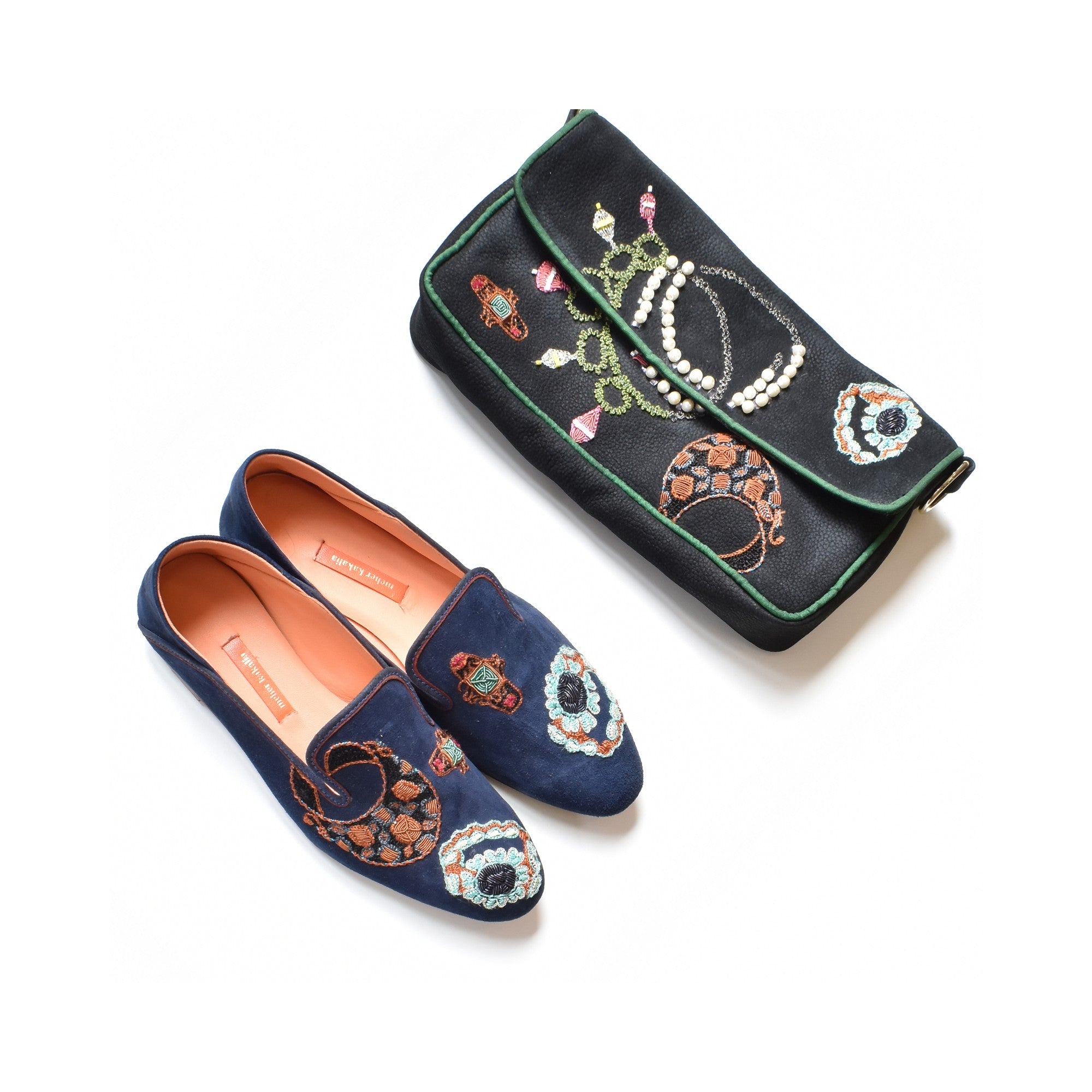 Jewel Clutch displayed with matching embroidered loafers