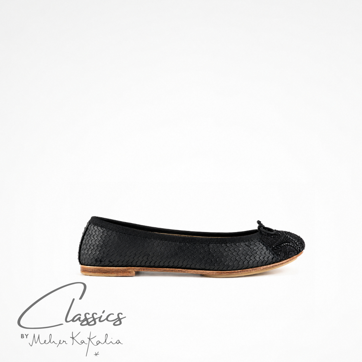 Black leather BIZI ballet flat with hand-embroidered toe cap, side view